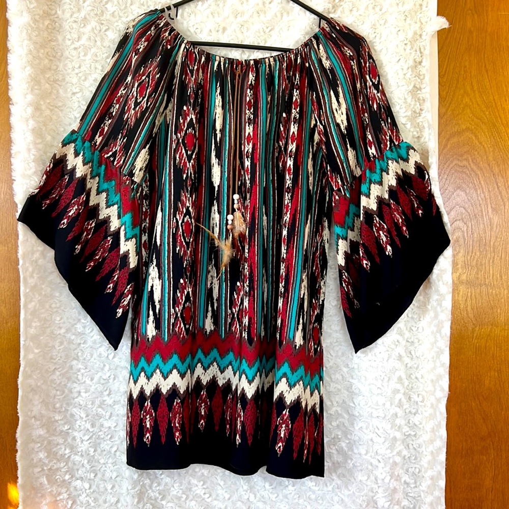 Can be worn as blouse or dress.